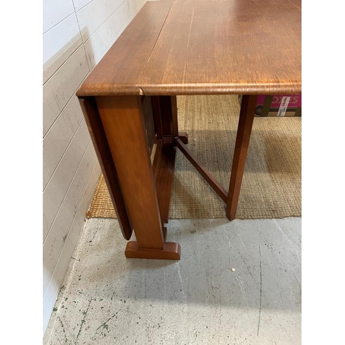 12 - A Mid Century drop leaf dining table (H74cm W123cm)