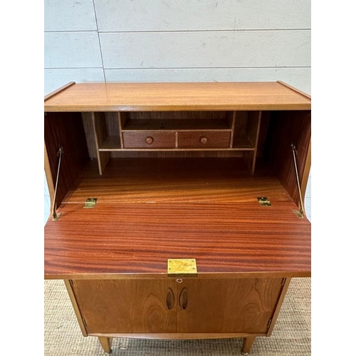 14 - A teak Mid Century bureau, single long drawer with cupboard under. The fall opening to two small dra... 