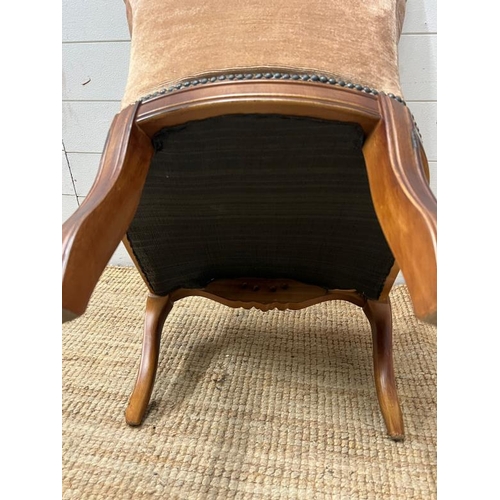 105 - A button back slipper chair on cabriole legs