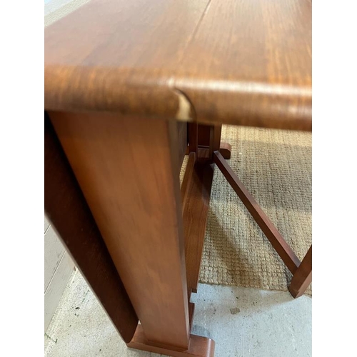 12 - A Mid Century drop leaf dining table (H74cm W123cm)