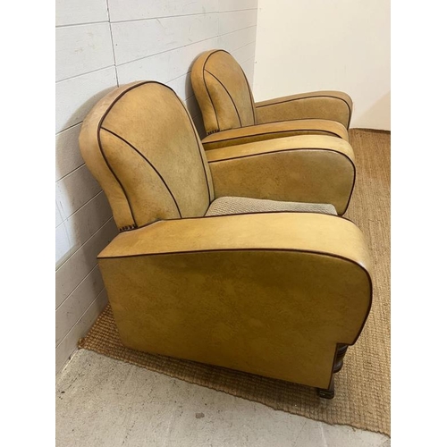 133 - A pair of Art Deco club chairs, beige with red piping