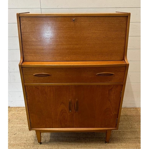 14 - A teak Mid Century bureau, single long drawer with cupboard under. The fall opening to two small dra... 