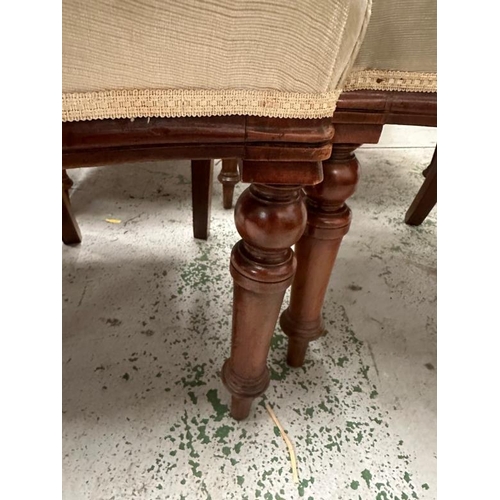 105 - A set of six balloon back chairs on turned front legs in a beige upholstery