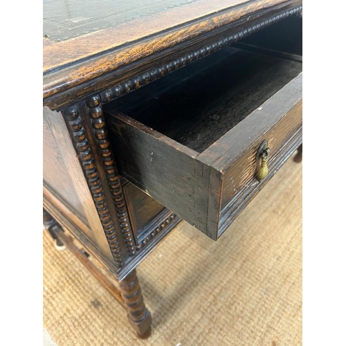 116 - 1920's Jacobean style kneehole desk with leather top over an arrangement of four frieze drawers (109... 