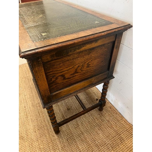 116 - 1920's Jacobean style kneehole desk with leather top over an arrangement of four frieze drawers (109... 