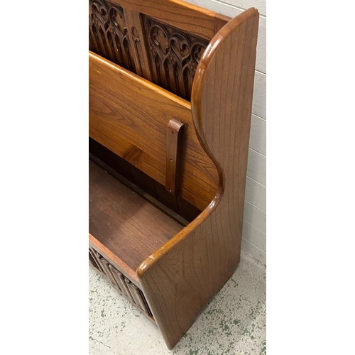 83 - A Gothic style monks bench with hinged lid and linen fold detail (H103cm W94cm D41cm)