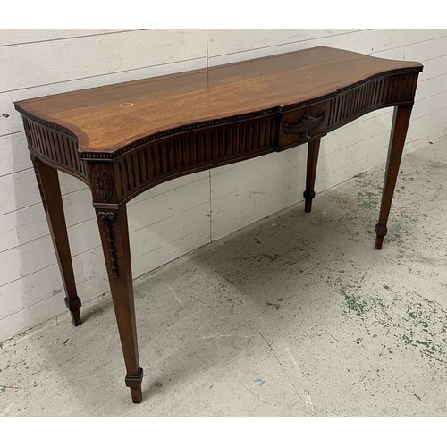 88 - A mahogany serpentine serving table/console on tapering legs (H84cm W137cm D54cm)