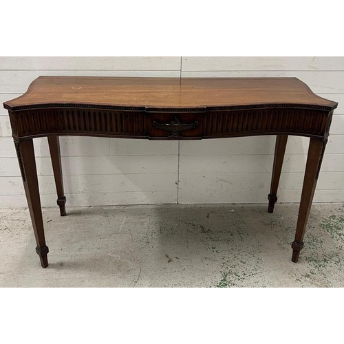 88 - A mahogany serpentine serving table/console on tapering legs (H84cm W137cm D54cm)