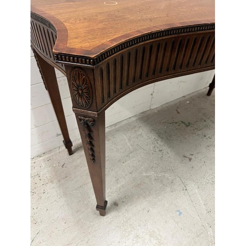 88 - A mahogany serpentine serving table/console on tapering legs (H84cm W137cm D54cm)