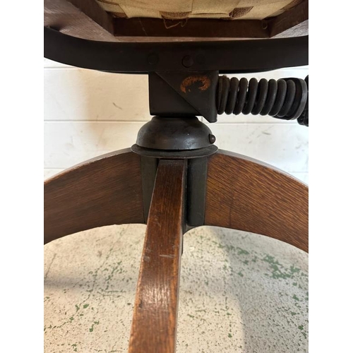 91 - A 1930's oak swivel office chair along with an oak tile back hall chair and a plant stand