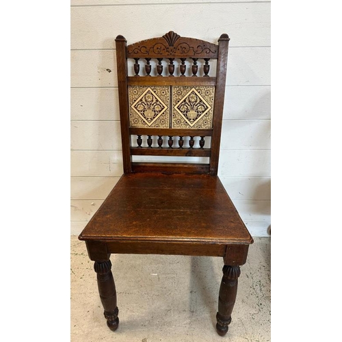 91 - A 1930's oak swivel office chair along with an oak tile back hall chair and a plant stand