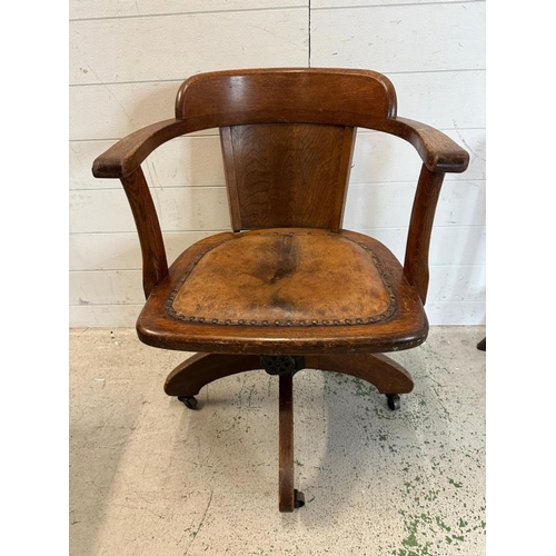 91 - A 1930's oak swivel office chair along with an oak tile back hall chair and a plant stand