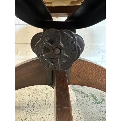 91 - A 1930's oak swivel office chair along with an oak tile back hall chair and a plant stand