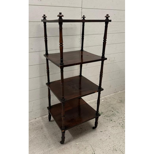 98 - A mahogany three tier whatnot, turned supports, castors and finials to top (H125cm W40cm D34cm)