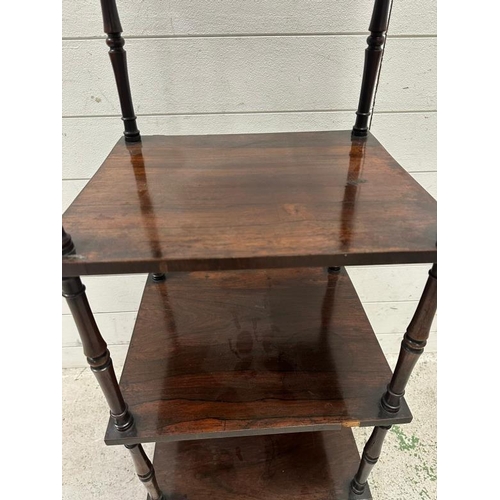 98 - A mahogany three tier whatnot, turned supports, castors and finials to top (H125cm W40cm D34cm)