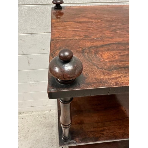 98 - A mahogany three tier whatnot, turned supports, castors and finials to top (H125cm W40cm D34cm)