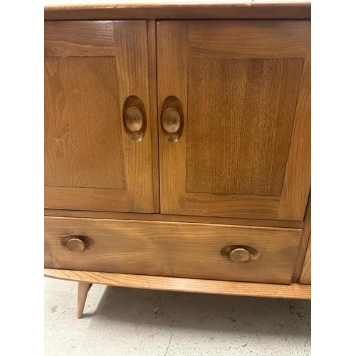 181 - An Ercol mid-century sideboard with two cupboards and one long drawer H82114 X 48