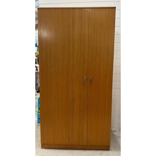 190 - A Stag wardrobe with cross hanging and five interior shelves (H178cm W92cm D56cm)