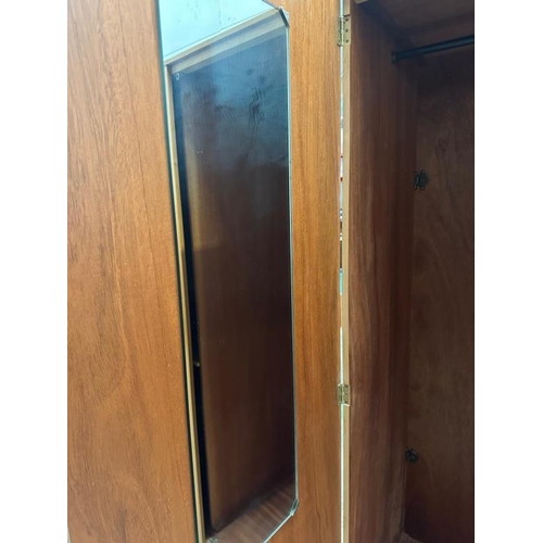 190 - A Stag wardrobe with cross hanging and five interior shelves (H178cm W92cm D56cm)