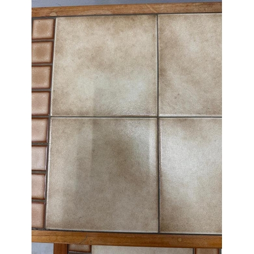 193 - A nest of three Mid Century tile topped tables (Largest H43cm W56cm D34cm)