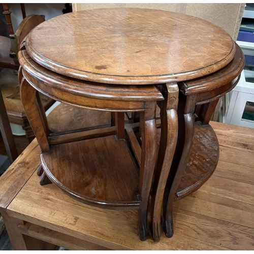 195 - A circular side table with four nesting tables under (H52cm Dia58cm)