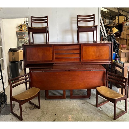 196 - An Elliot's of Newbury metamorphic dining set comprising of table, sideboard and four chairs