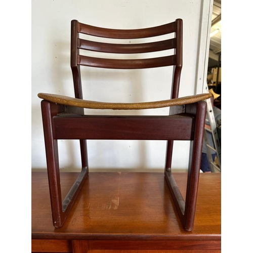 196 - An Elliot's of Newbury metamorphic dining set comprising of table, sideboard and four chairs