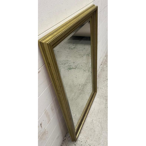 203 - A gold painted bevel edged mirror 67cm x 96cm