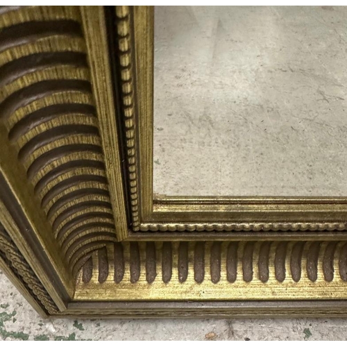 203 - A gold painted bevel edged mirror 67cm x 96cm