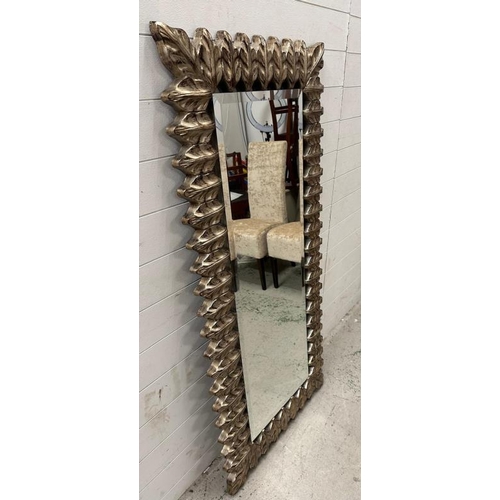 205 - A bevel edged hall mirror with foliate frame
