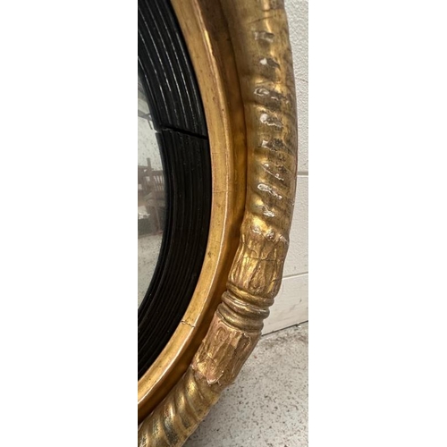 206 - A gold circular gold painted butlers porthole mirror. Diameter 46cm