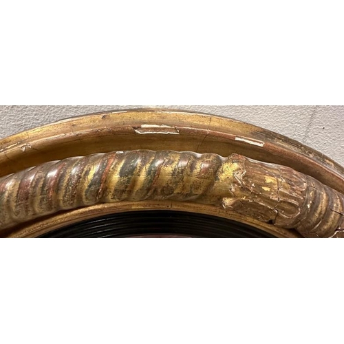 206 - A gold circular gold painted butlers porthole mirror. Diameter 46cm