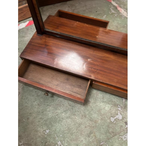 208 - A long rectangular dressing mirror, swivel mirror sits on a rectangular base with two long drawers