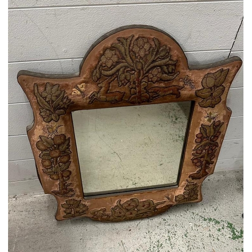 209 - An Arts and Crafts style mirror in an embroidered cushion frame featuring deer and trees 57cm x 72cm