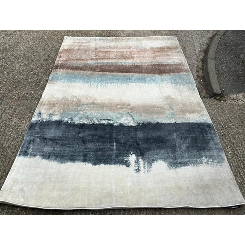 210 - A Rochebobois of Paris hand woven rug in clay, blues and greys. 200x300 cm