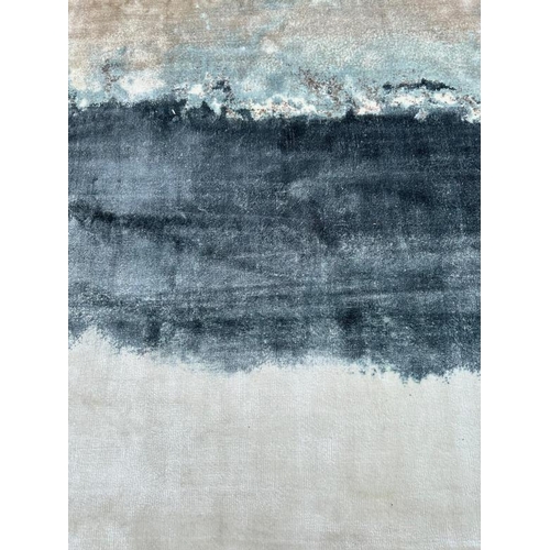 210 - A Rochebobois of Paris hand woven rug in clay, blues and greys. 200x300 cm