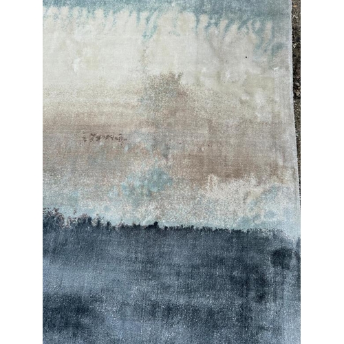 210 - A Rochebobois of Paris hand woven rug in clay, blues and greys. 200x300 cm