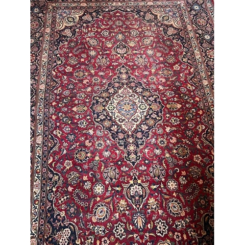 212 - Large Persion style rug with central medallion and four scrolling corners 138cm X 233cm