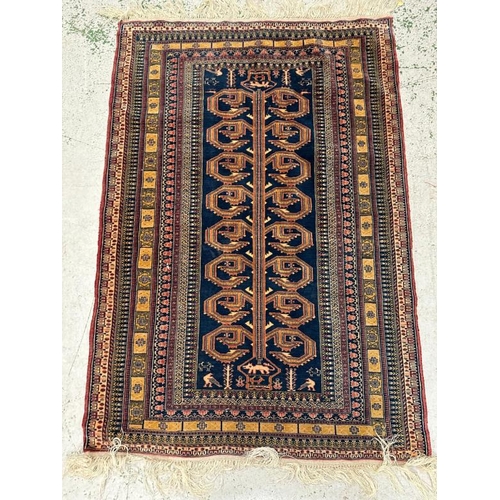 213 - A blue ground rug with geometric border 147x100 cm