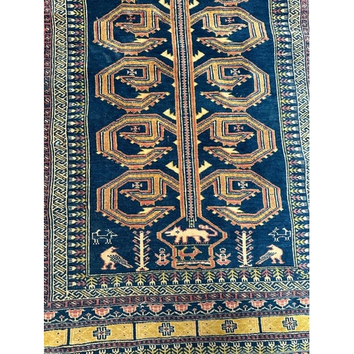 213 - A blue ground rug with geometric border 147x100 cm