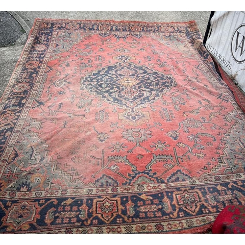 214 - Large rug with centre medallion, blue and red grounds, 157 X 160 cm AF