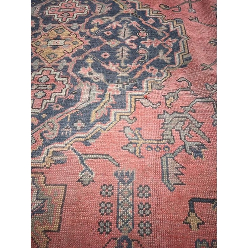 214 - Large rug with centre medallion, blue and red grounds, 157 X 160 cm AF