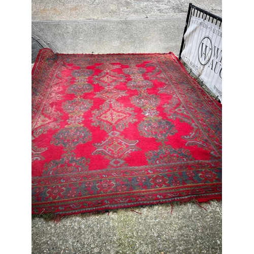 215 - Large red rug with geometric design, 147 X 121cm AF