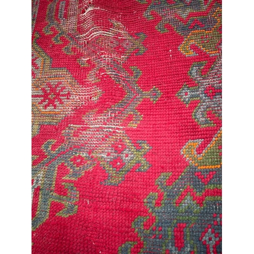 215 - Large red rug with geometric design, 147 X 121cm AF