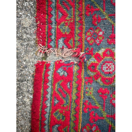 215 - Large red rug with geometric design, 147 X 121cm AF