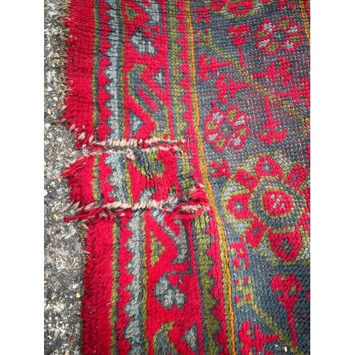 215 - Large red rug with geometric design, 147 X 121cm AF