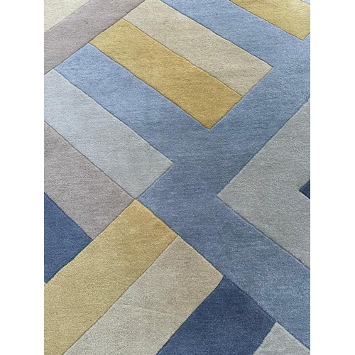218 - A contemporary rug in a blue, yellow and green zigzag pattern. 162x234 cm