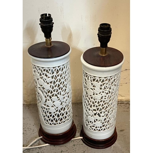225 - A pair of oriental style white pierced Lamps