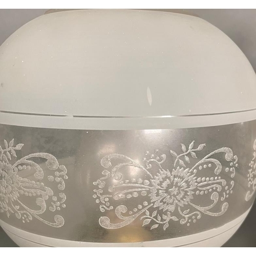 235 - A Pair of bras and glass wall oil lamps on ornate arm.