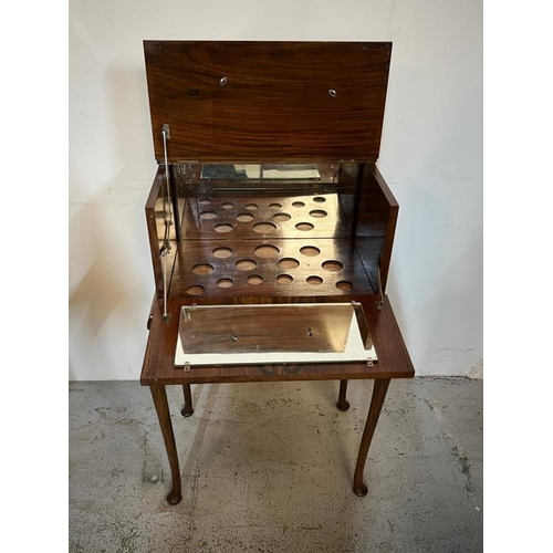 44 - Metamorphic Cocktail cabinet on out swept legs, W54 X D37 X H100cm